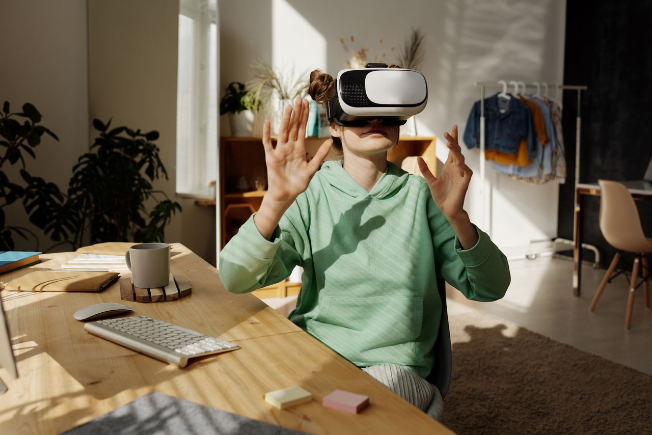 A learner exploring an immersive experience with a VR headset