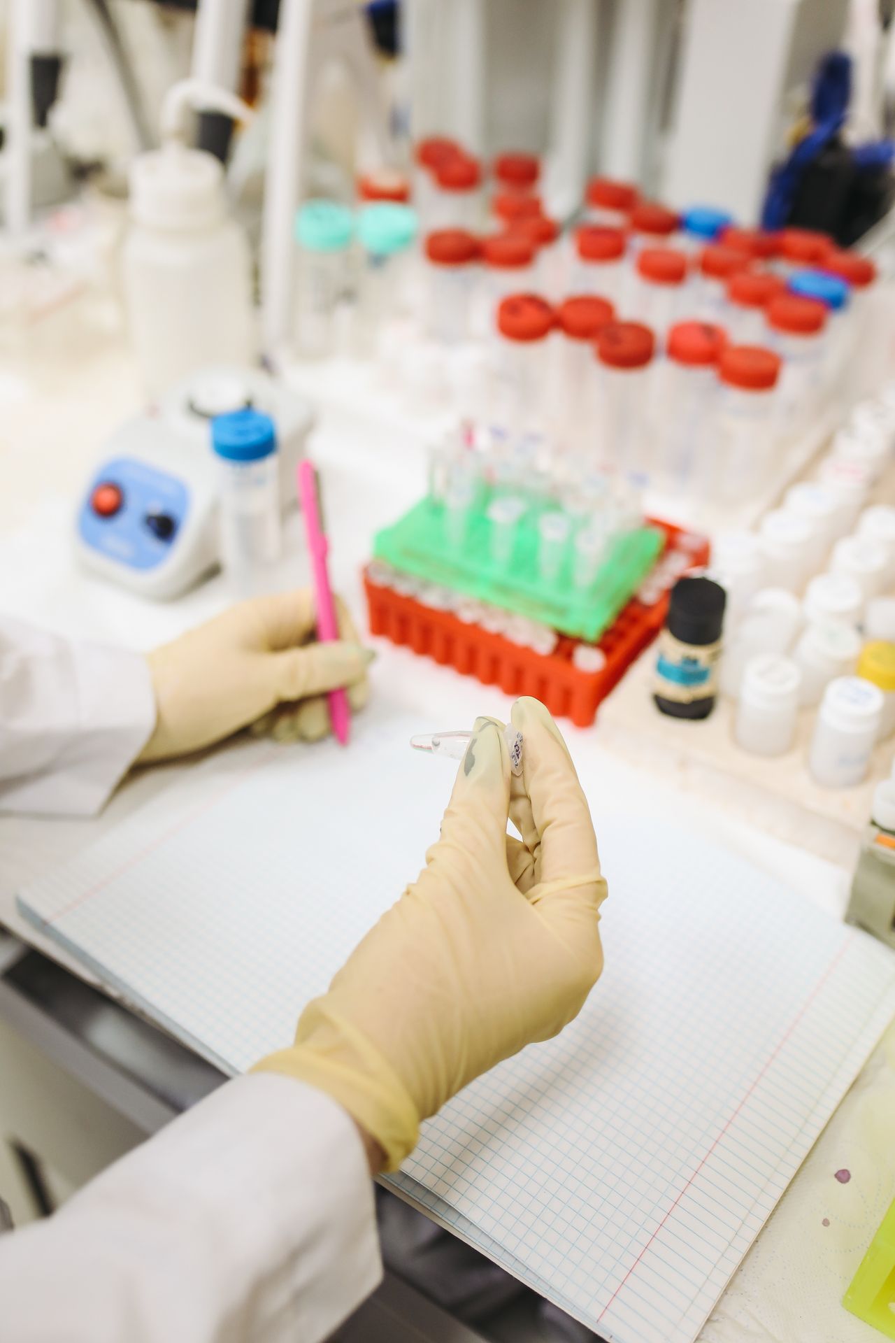 A scientist carefully examining laboratory samples