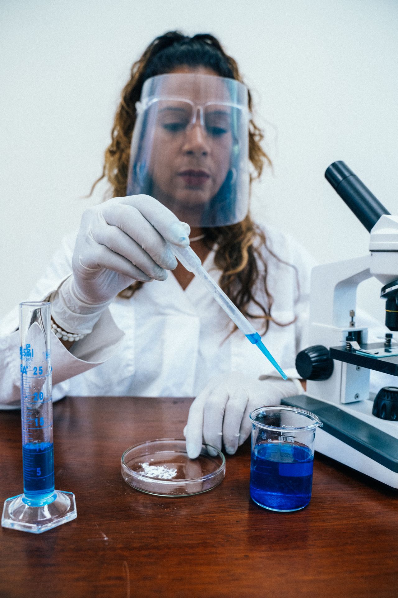 A researcher conducting an experiment with laboratory equipment