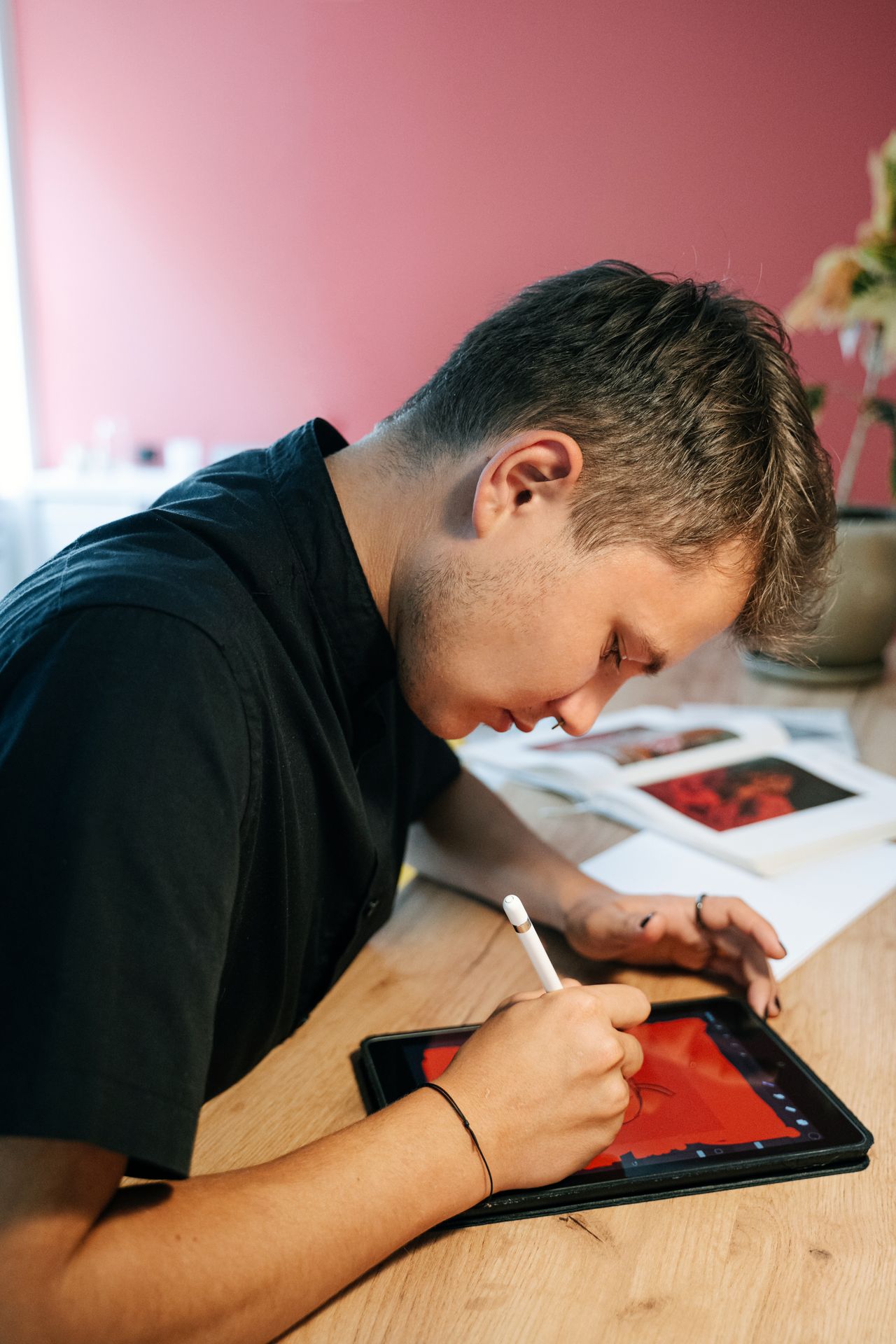 A designer sketching ideas on a digital tablet