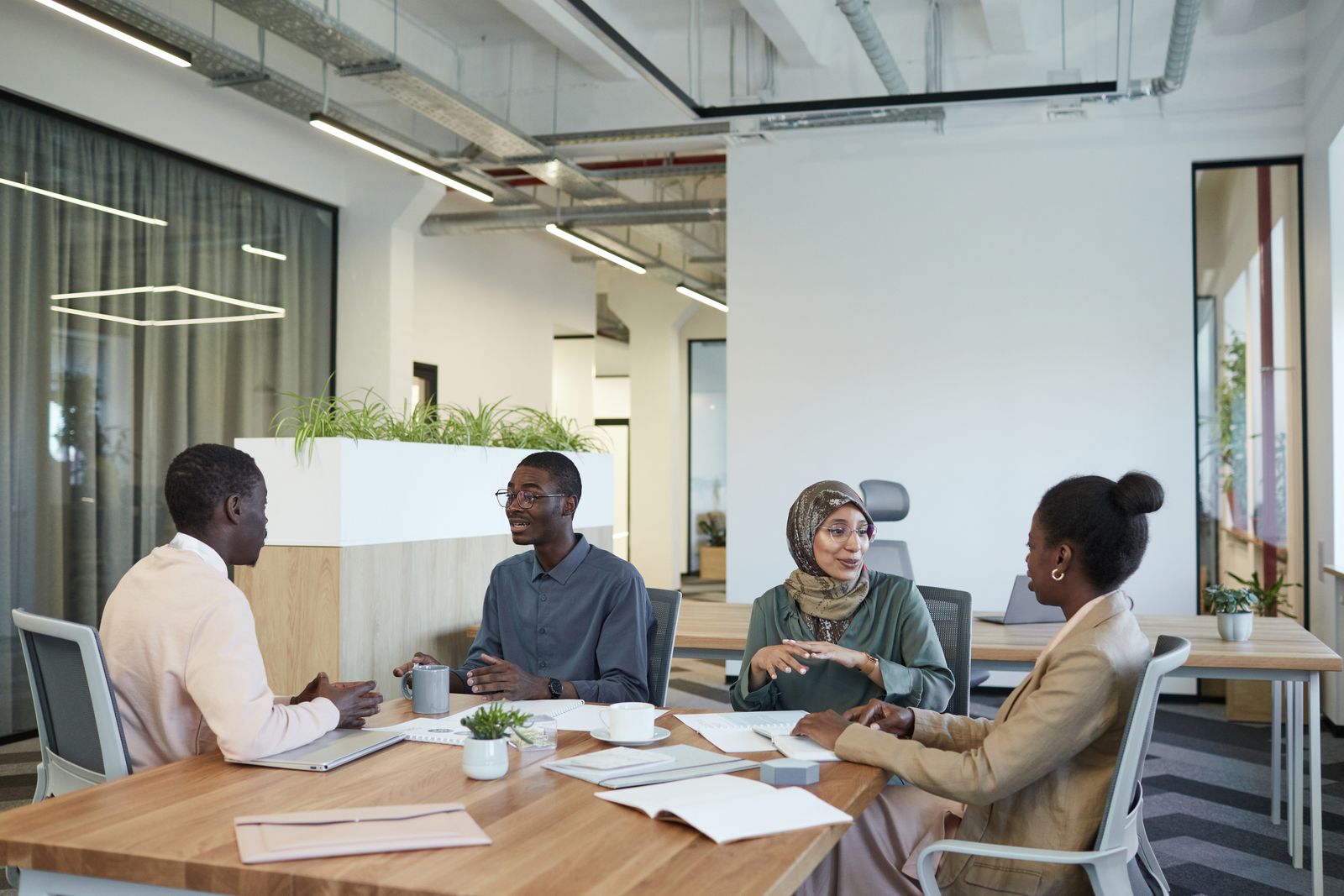 Professionals sharing ideas around a meeting table